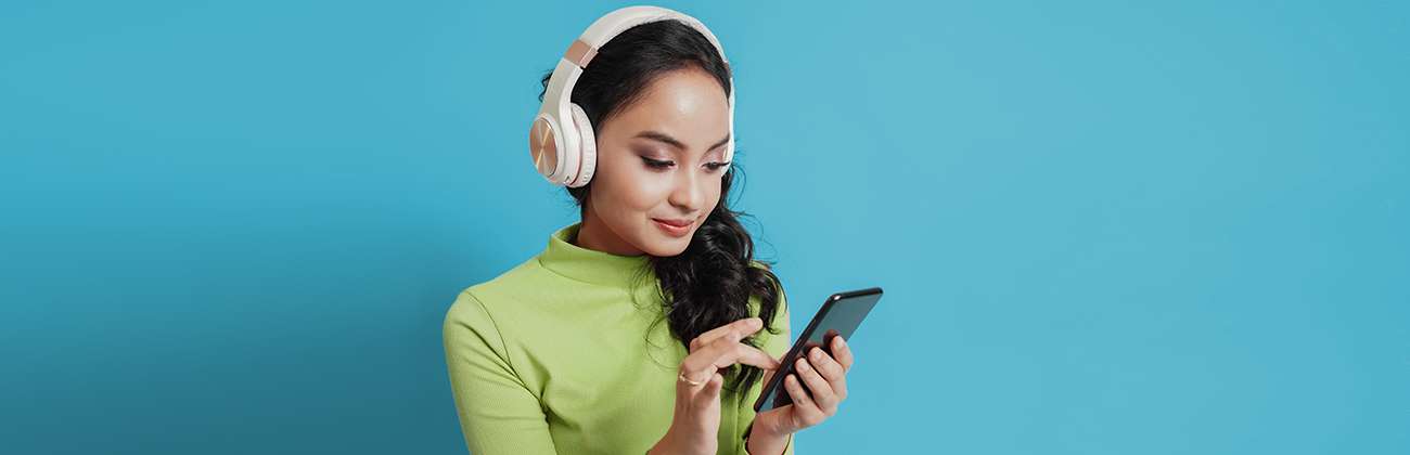 Woman in headphones on phone