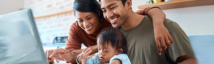 A young family on a laptop