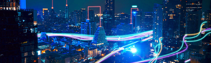 night time city view with streams of light symbolizing the speed of fiber connections